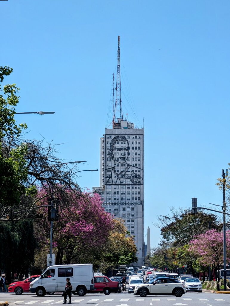 A grand building showcasing a portrait of Eva Peron, as seen on one of the free walking tours of Buenos Aires, Argentina