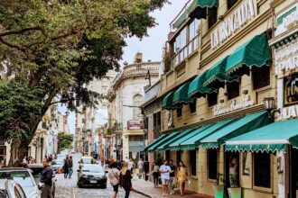 Street in San Telmo, Buenos Aires, Argentina with shops with green awnings.