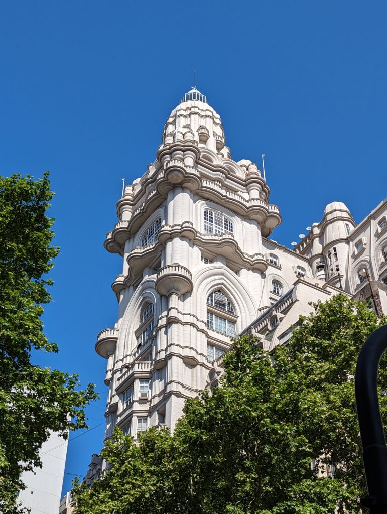 Palacio Barolo tower, a majestic white building with a prominent clock tower standing tall as seen on one of the free walking tours of Buenos Aires, Argentina