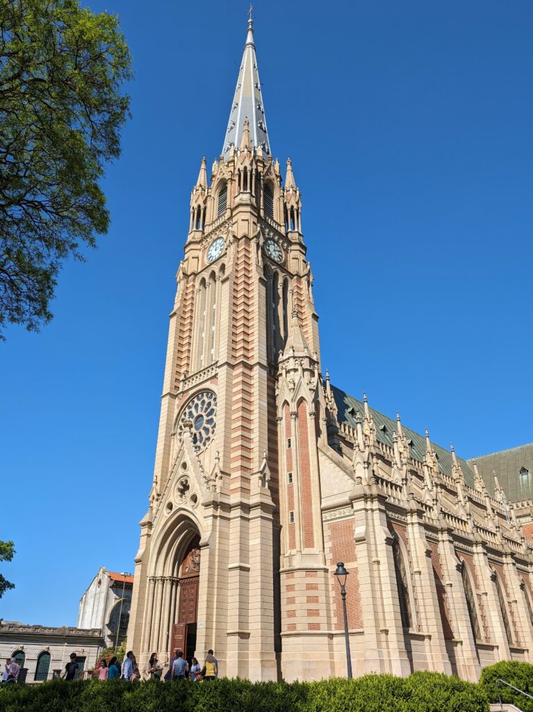 Brick and limestone church standing in the sunlight