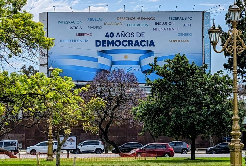 Billboard in a park celebrating "40 years of democracy"