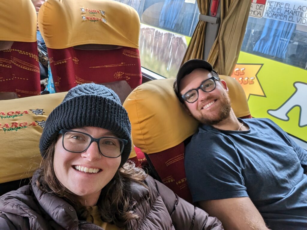 Two people reclining on a bus