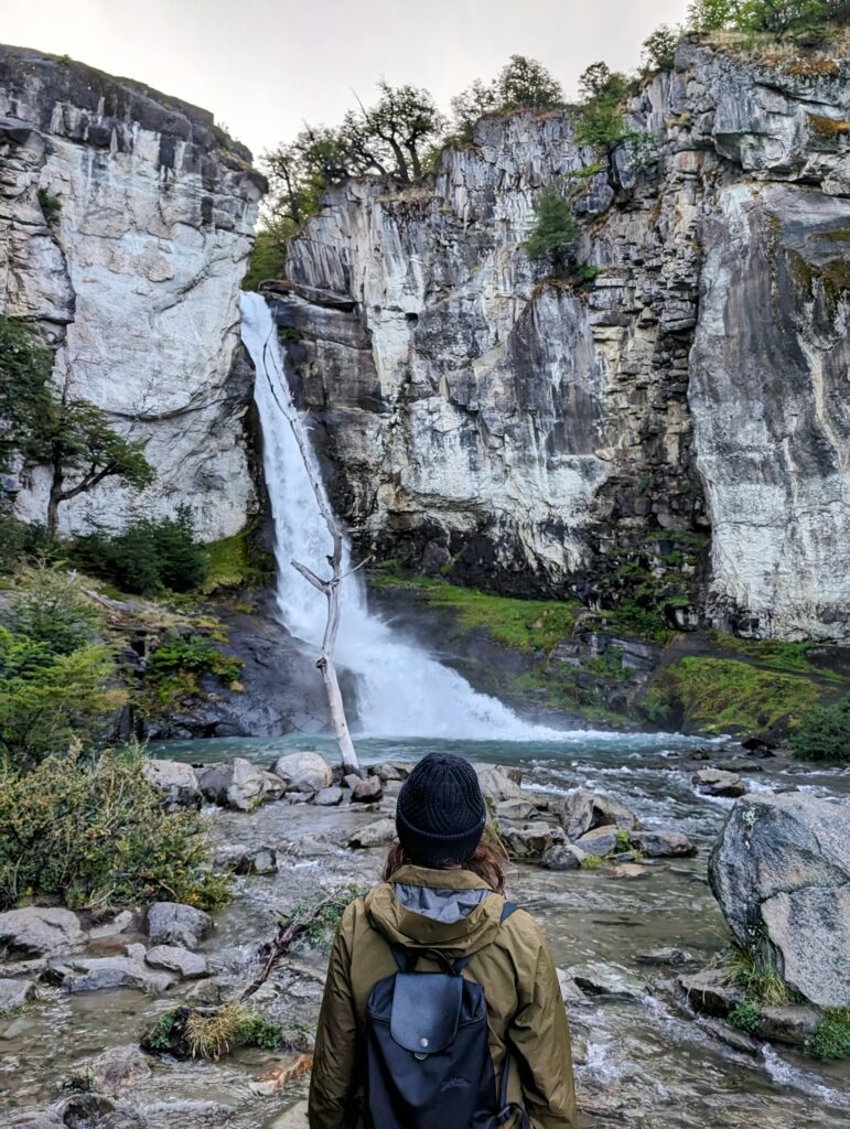 A person looking at a waterfall