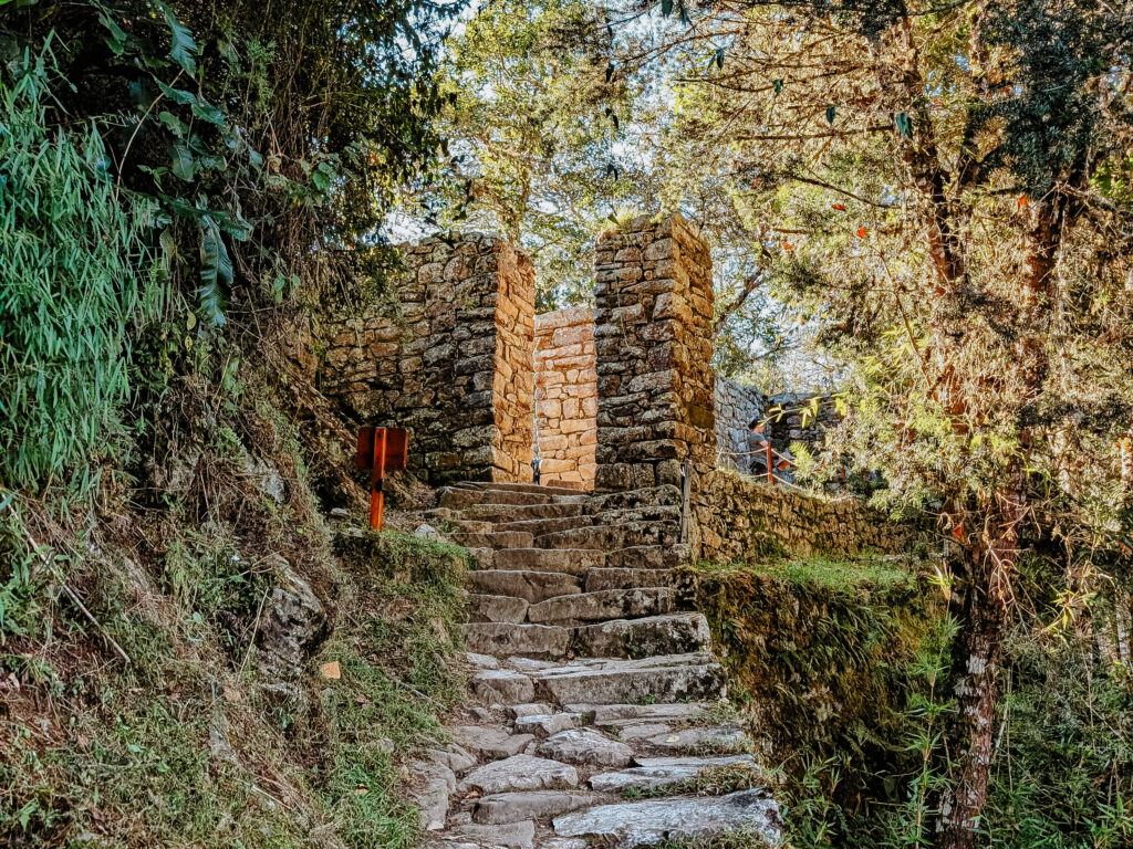 A path leading to a stone entrance on the Short Inca Trail