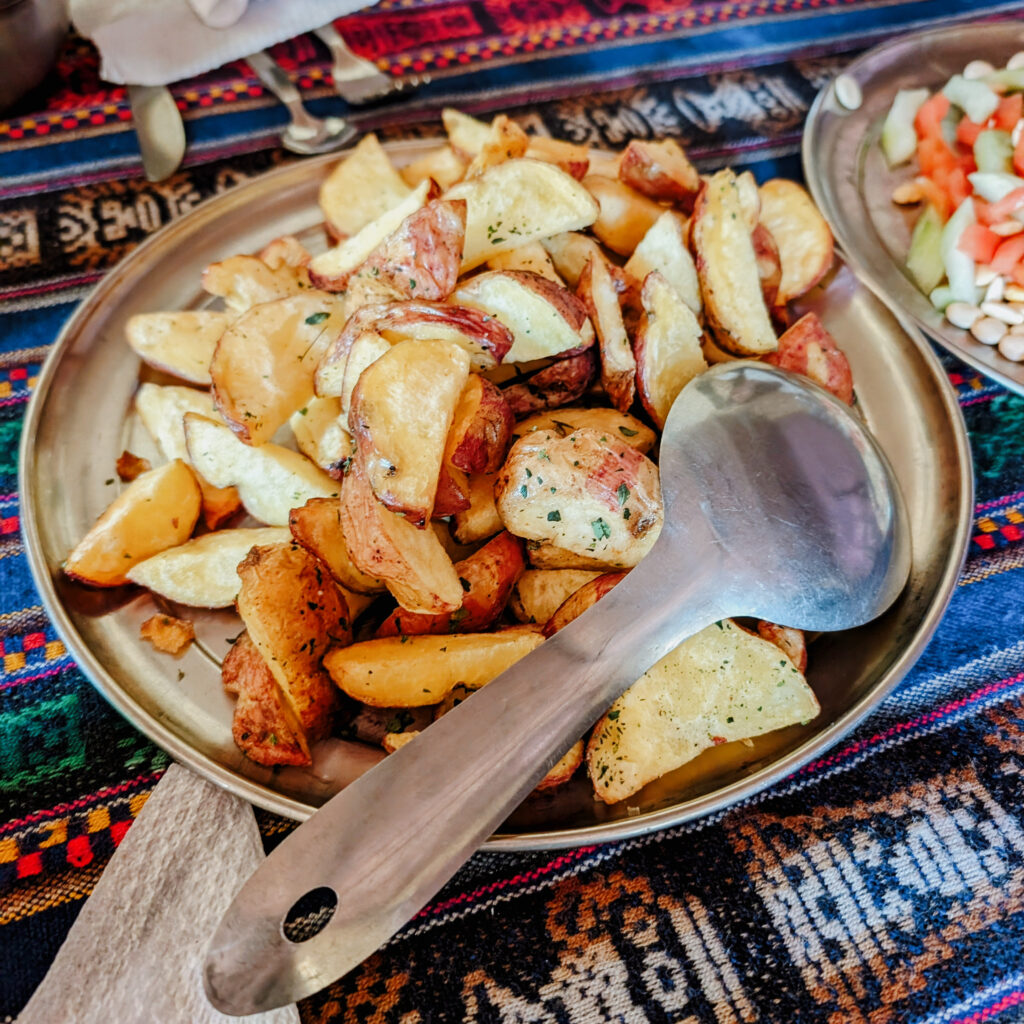 A plate of roasted potatoes for a meal on the Lares Trek