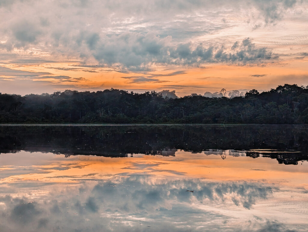 A sunset over a lake in the Amazon Rainforest