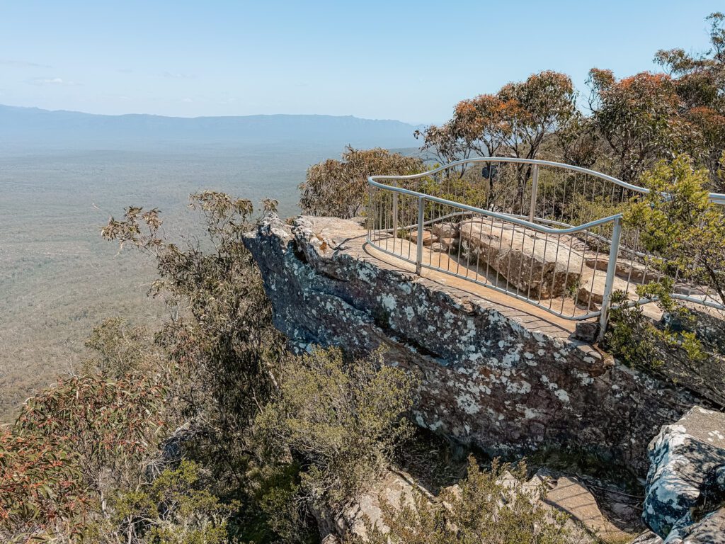 The view from and overlook onto a rock and a valley in Grampians