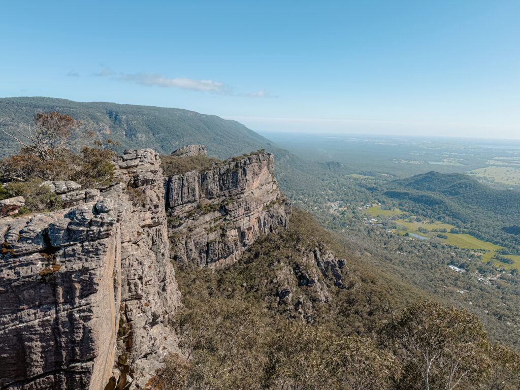 The view from and overlook onto a rock and a valley in Grampians