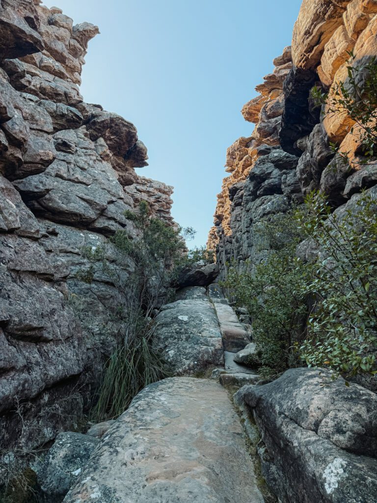 Hiking through a grey rocky canyon in Grampians