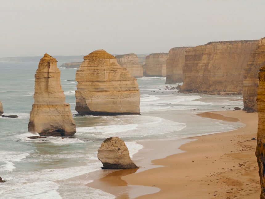 rock formations in an ocean along a cliff of the Great Ocean Road