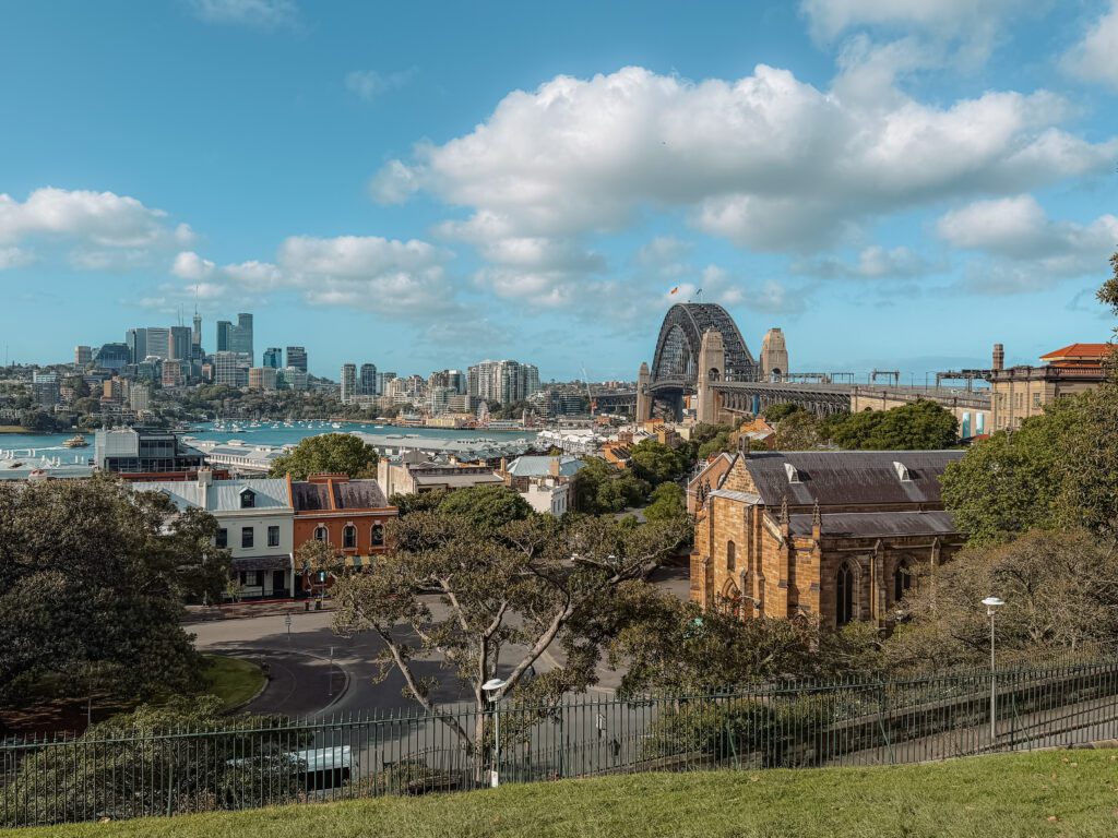 A view over the Sydney harbor with a view of the Sydney Harbor Bridge from the Observatory Hill in the Rocks neighborhood of Sydney, Australia