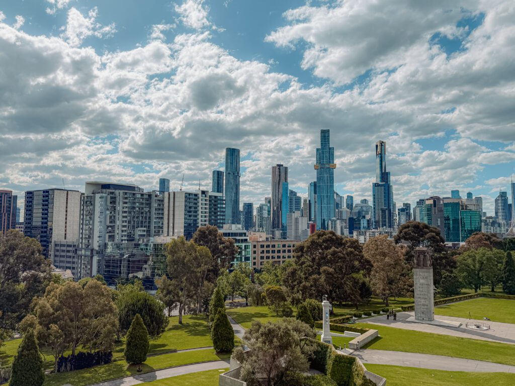 The city skyline of Melbourne, Australia behind a park