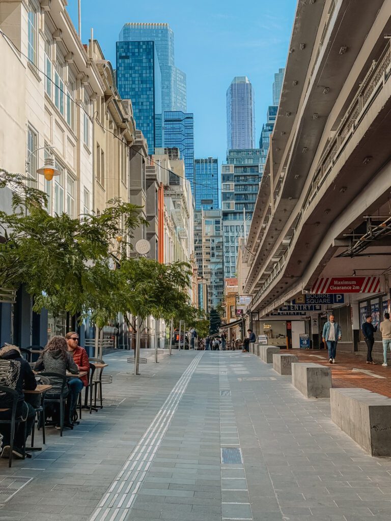 The street of a city with skyscrapers in the background in Melbourne